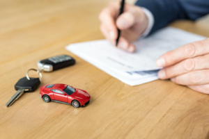 A red toy car and car keys